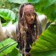 Johnny Depp as Captain Jack Sparrow hiding amongst plants