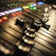 A sound board in a recording studio with sliders at various points