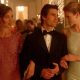 Actor Tom Cruise in Eyes Wide Shut, wearing a tuxedo, arm in arm with two women